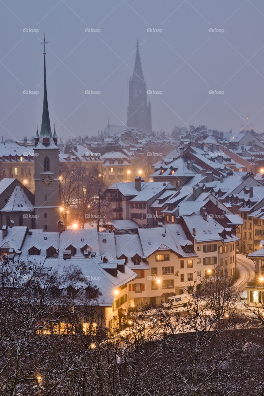 Old town of bern by night during snow storm.
