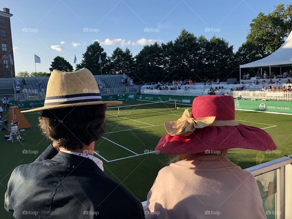 Hats at tennis game