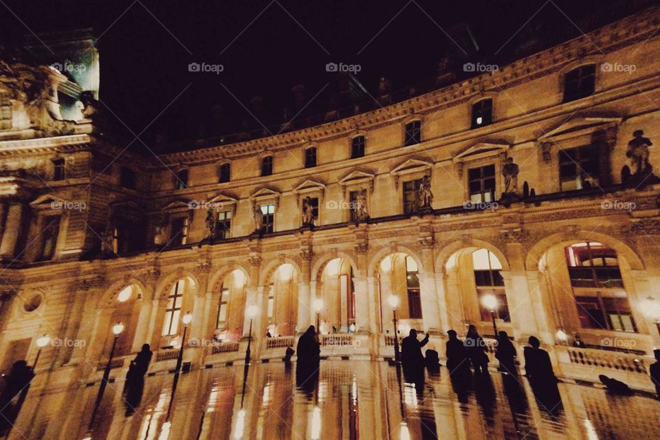 Night lights in Paris by Louvre museum.