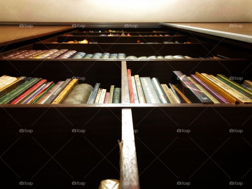 Reading. Relax and keep the mind fit. Two-in-one. A bookcase full of good books is never too much...