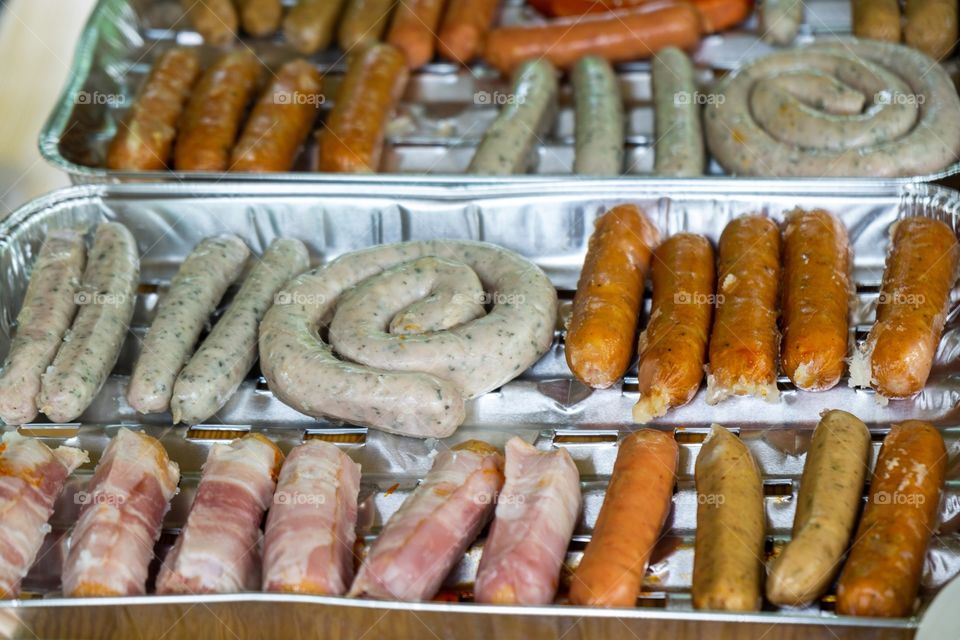 cooking the sausages and meat