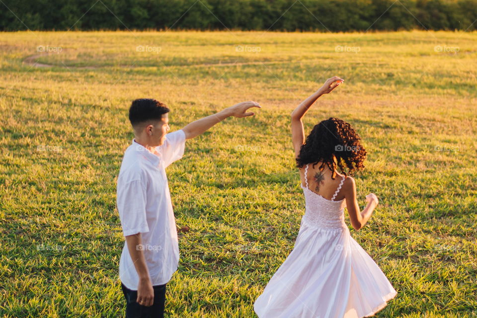 couple dancing in the field