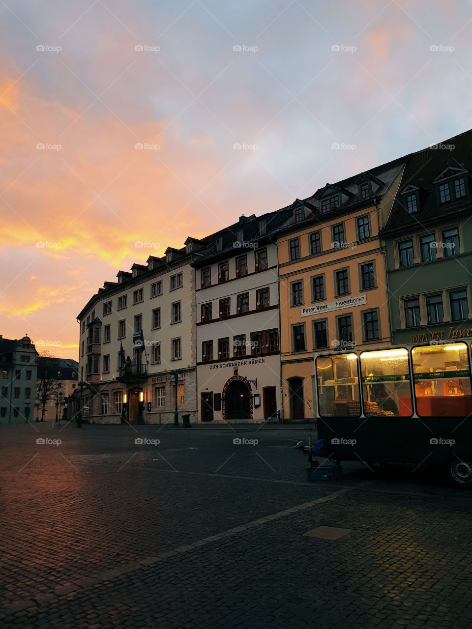 Weimar in the morning. German city. You see the market and a fantastic sunrise. My way to work.