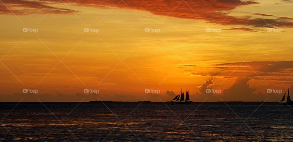Sunset, sail boat, pirate ship