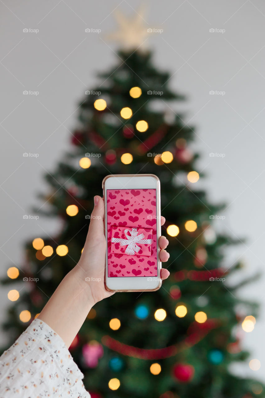 Woman hand holding smartphone