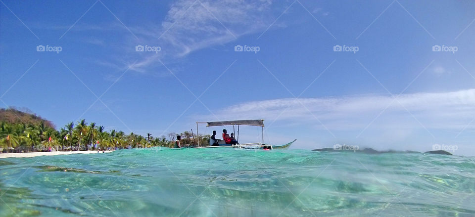 boat ride in clear turquoise sea waters summer time