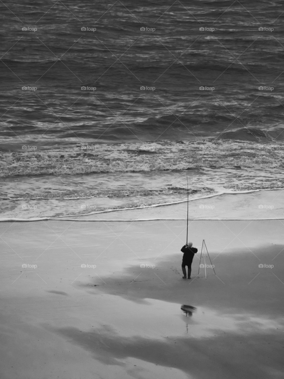 Lone angler black and white