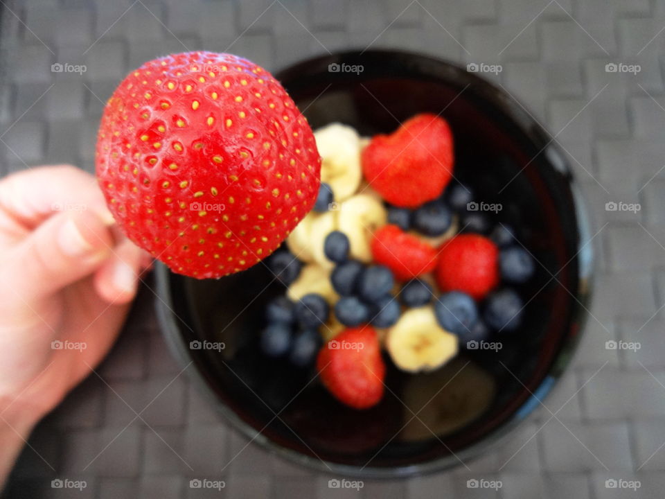 Healthy fruits breakfast full of vitamins with strawberry, kiwi, banana and berries