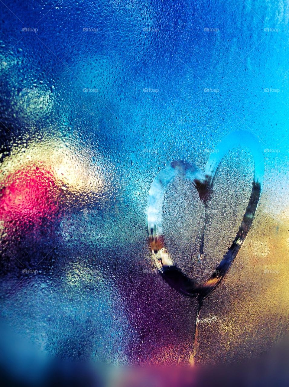 Sign of love heart on glass