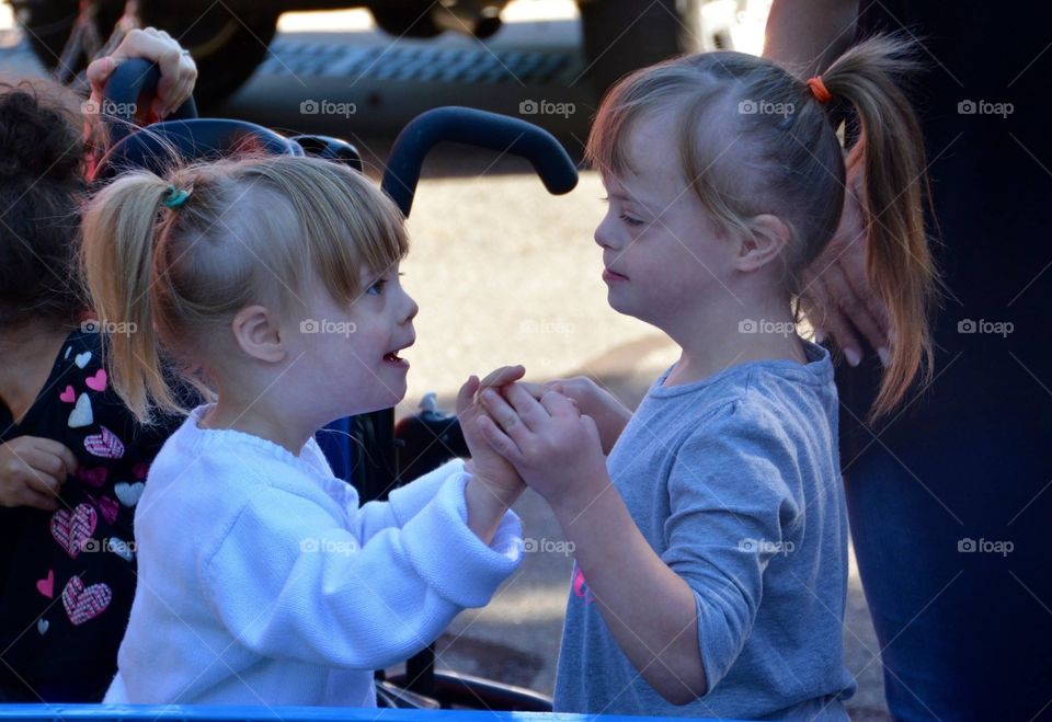 Biological sisters with Down syndrome, beautiful, sisters