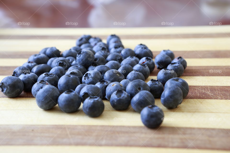Blueberries on a cutting board ready for a healthy snack. 