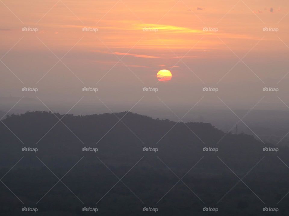 Far view of the sun early in the morning at high place