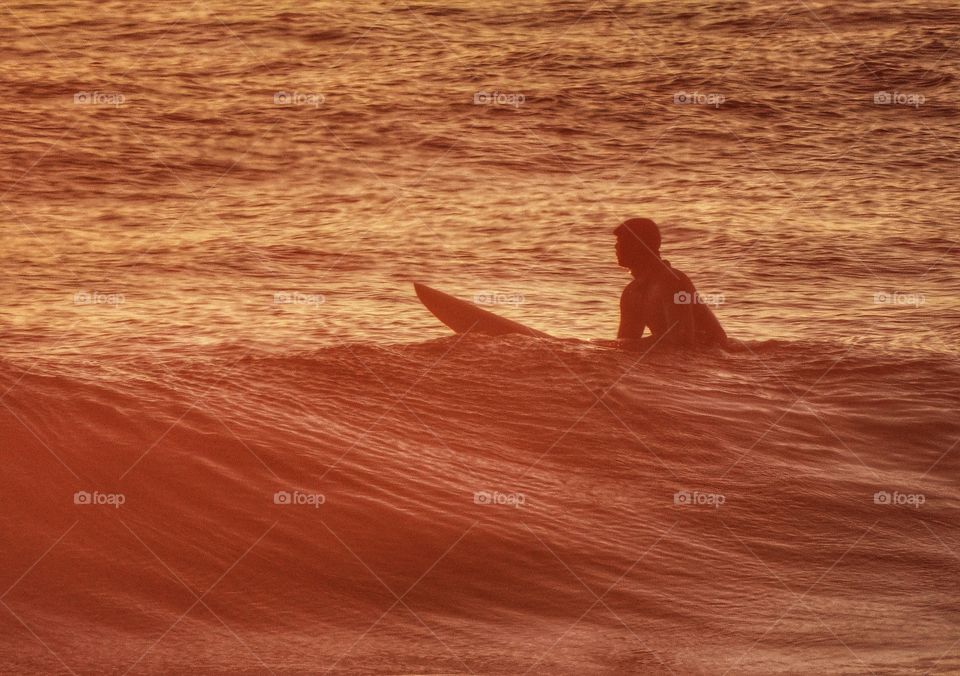 Surfing At Sunset