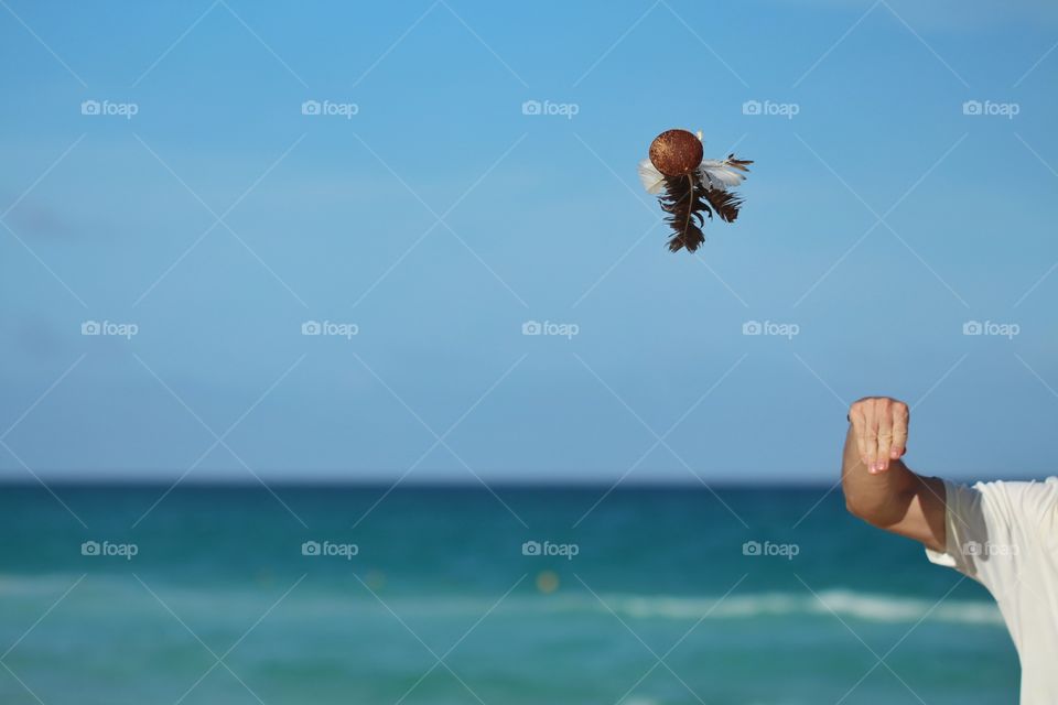 playing peteca game in The beach