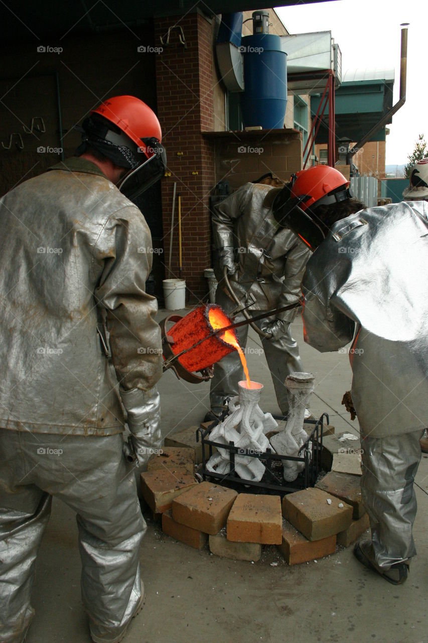 Just pouring 2200 degree bronze into colloidal silica molds.