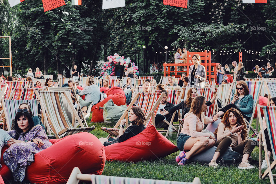 People relaxing on the chairs