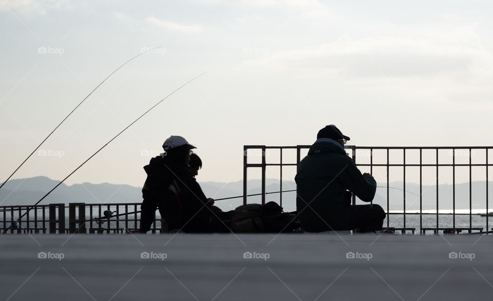 Relaxing while fishing in their holiday