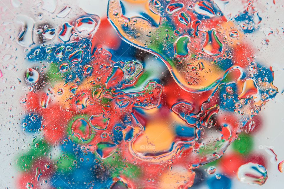 Abstract colorful painting with oil and water 