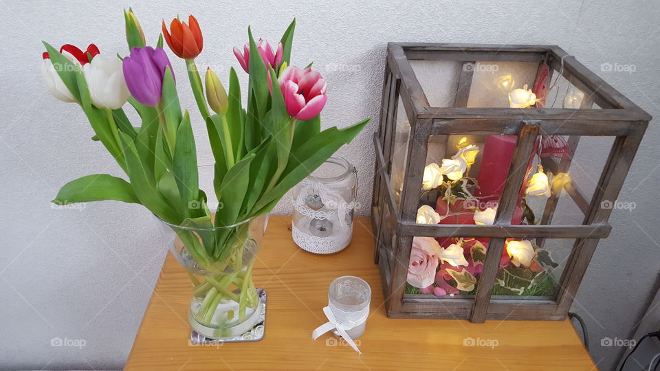 bunch of tulips on side table