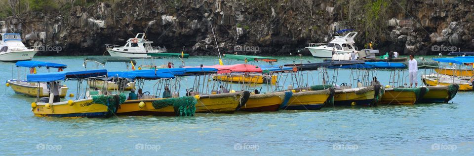 Colorfull boats at Puerto Ayora's sea, Galapagos.