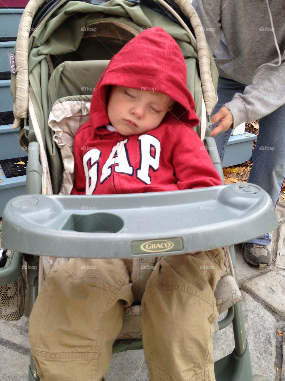 Someone got sleepy . Napping in the stroller