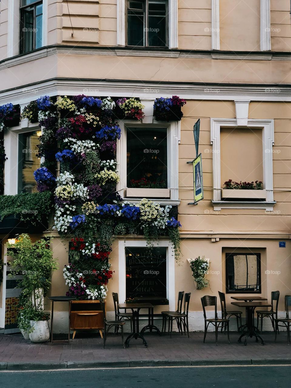 Summer in the city, beautiful facade with colourful flowers