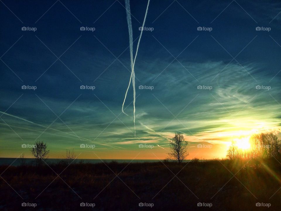 Contrail Sunrise Over Lake Michigan