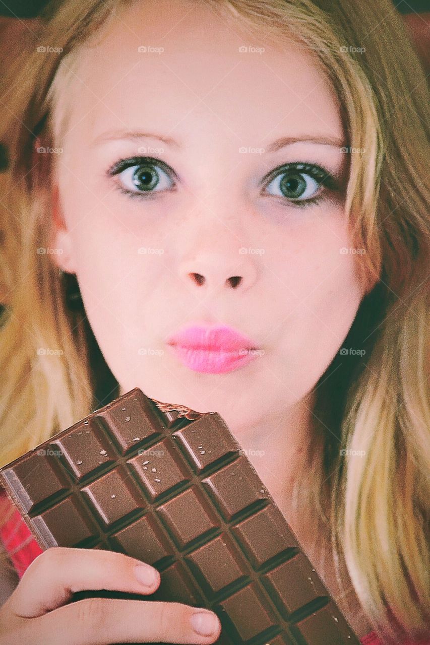 Tasty. Girl eating chocolate