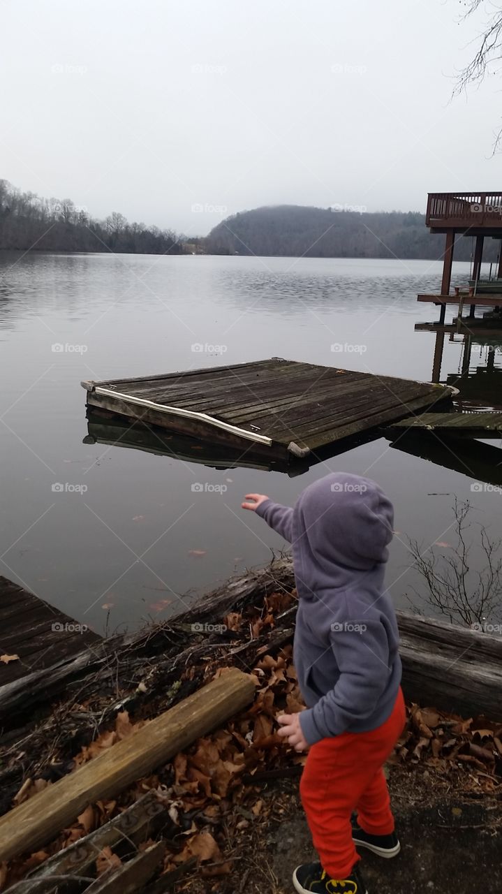 pointing out fish on the lake
