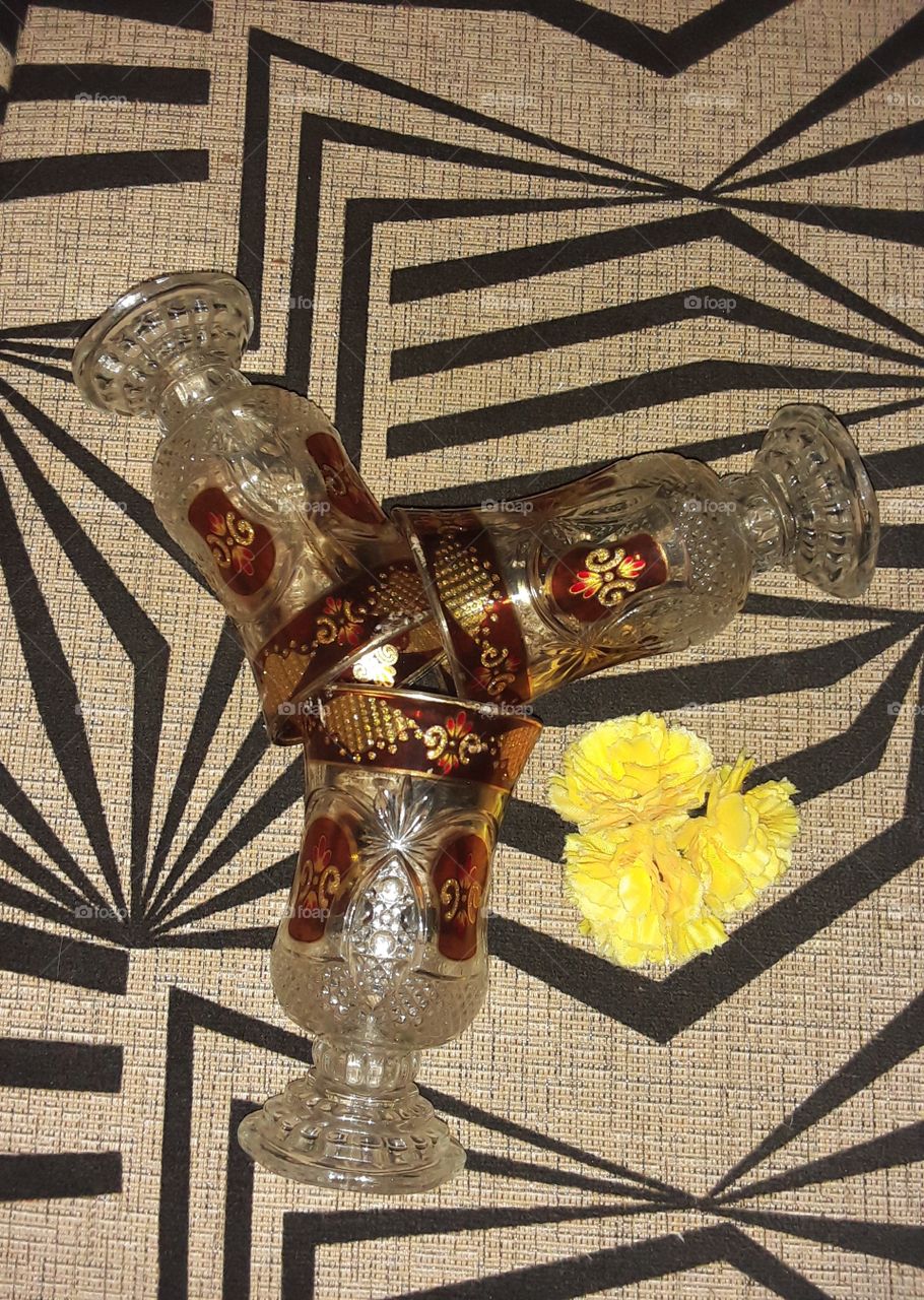 colourful glass with yellow flower bench