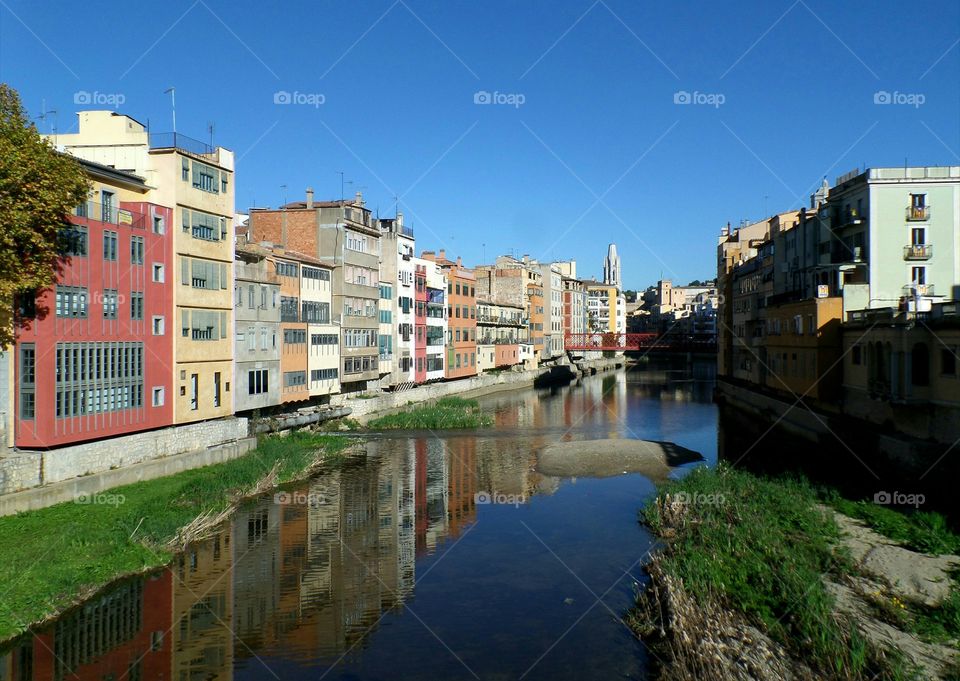 Colorful buildings along the Onyar river in Girona, Spain