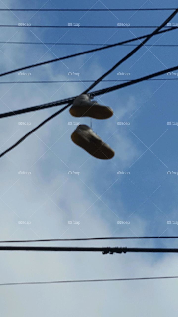 Sneakers on electrical wire