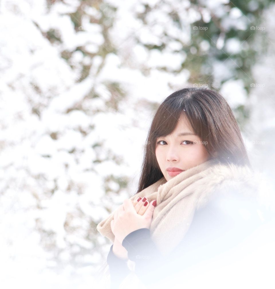 Pretty asian woman wearing winter clothes 