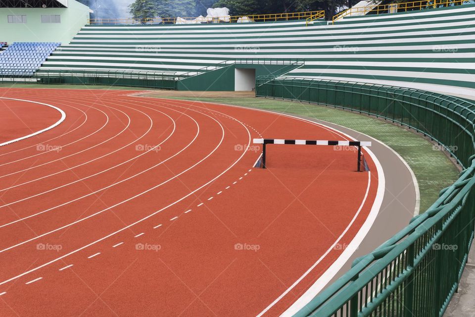 Hurdle on red running track