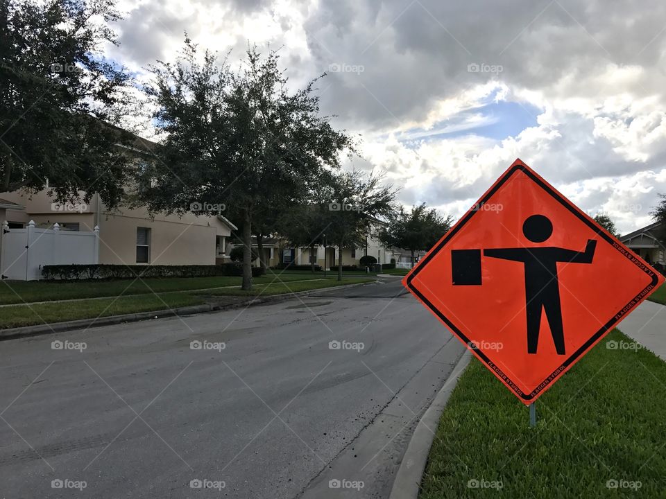 Orange sign-Men at work