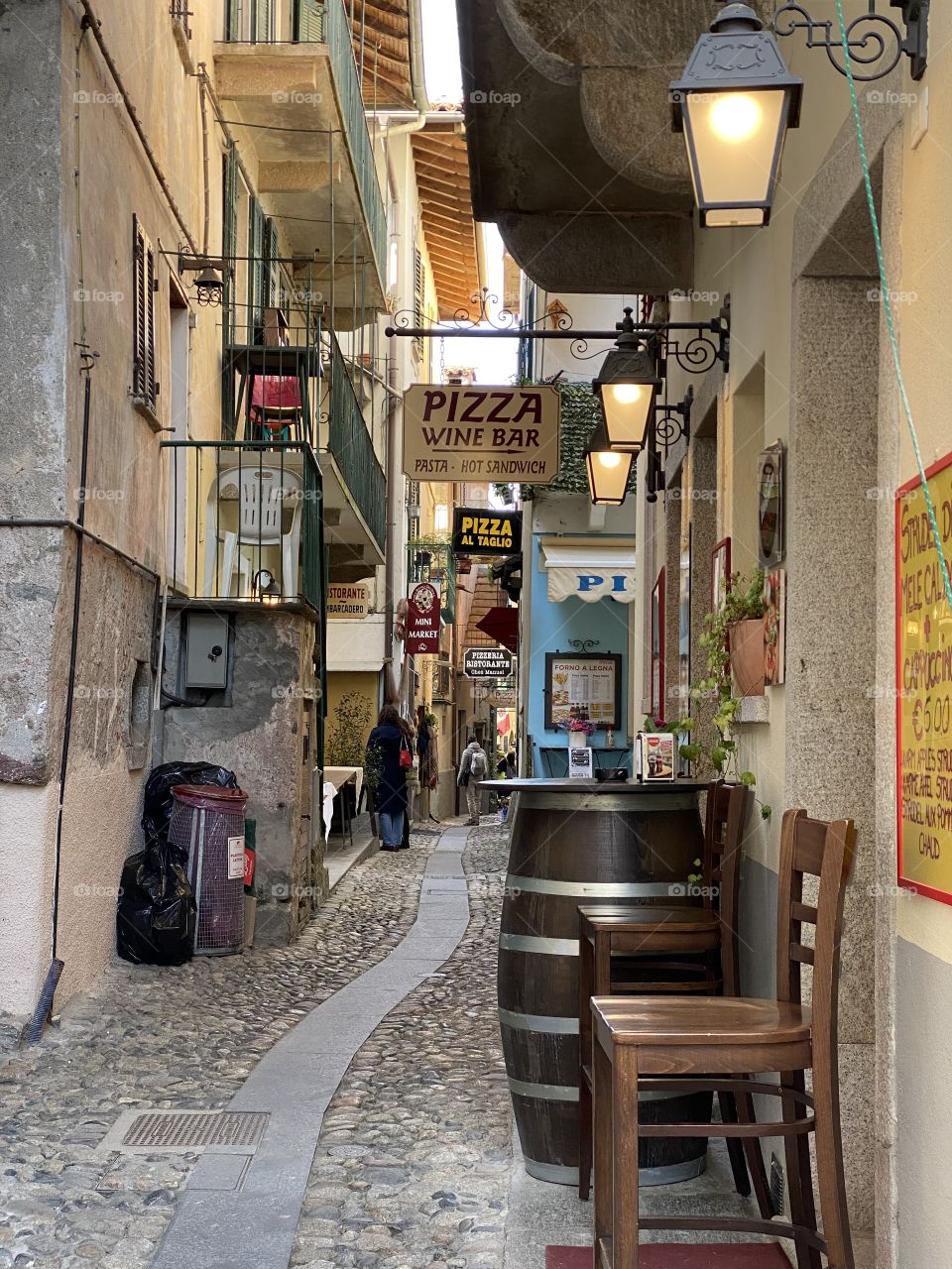 Quiet and narrow alley in Isola dei Pescatori in lake Maggiore.