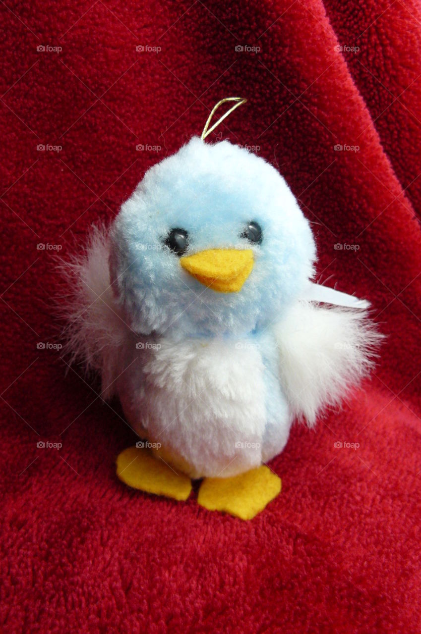 cute fluffy chick soft toy - baby blue bird with little yellow beak and feet - ball of fluff