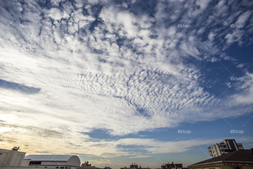 Cirrocumulus Clouds over buildings