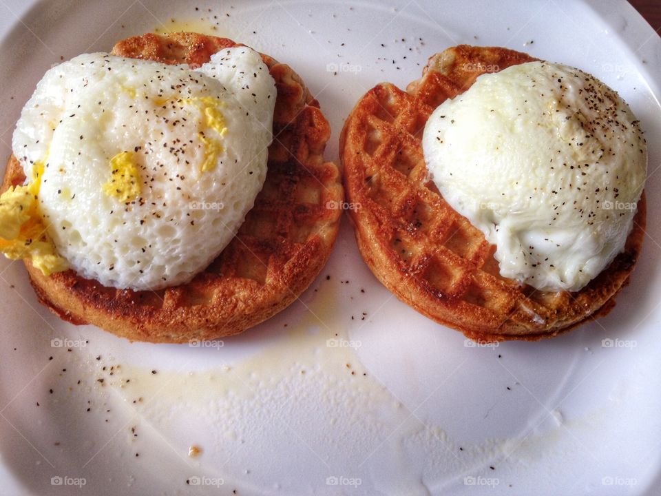 Healthy and easy breakfast. Poached eggs on waffles