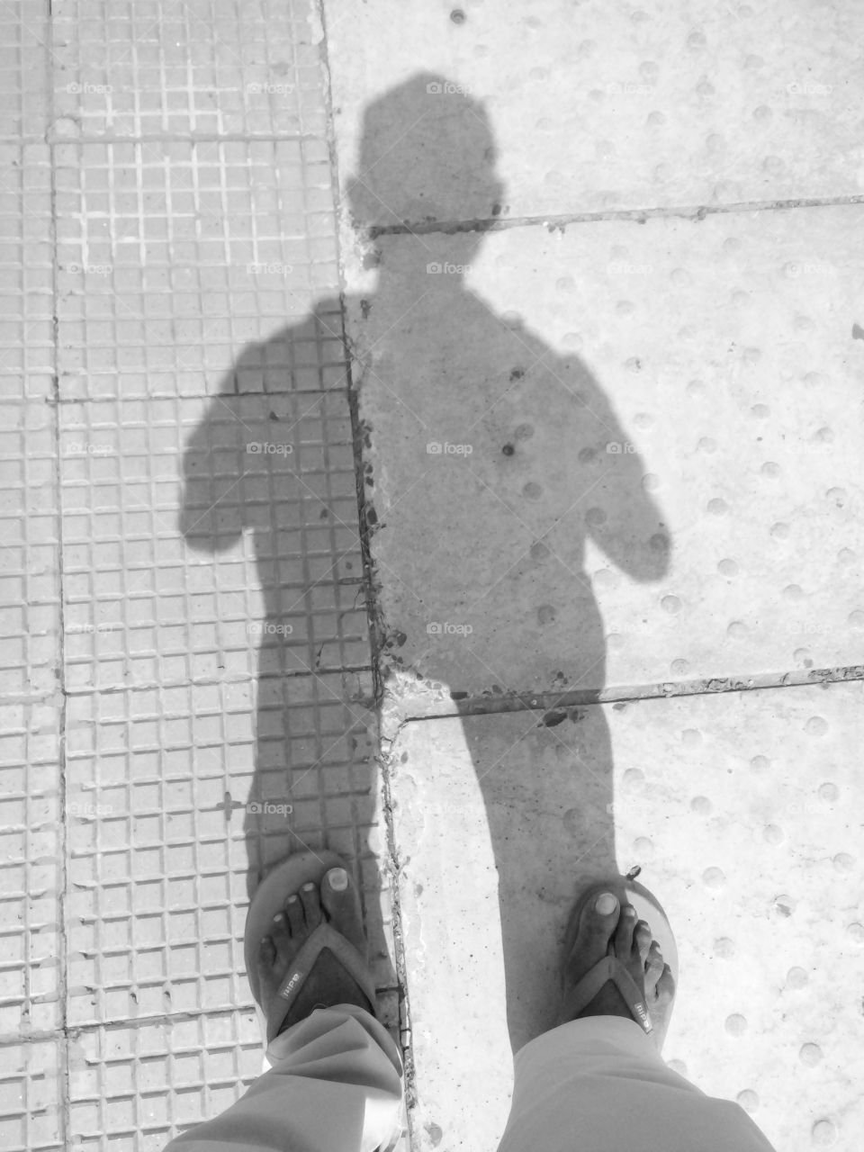 Photo with shadow / shadow of a man / shadow of a man in sunlight / photo of a man with shadow / shadow and man with one arm / both incomplete without each other /
