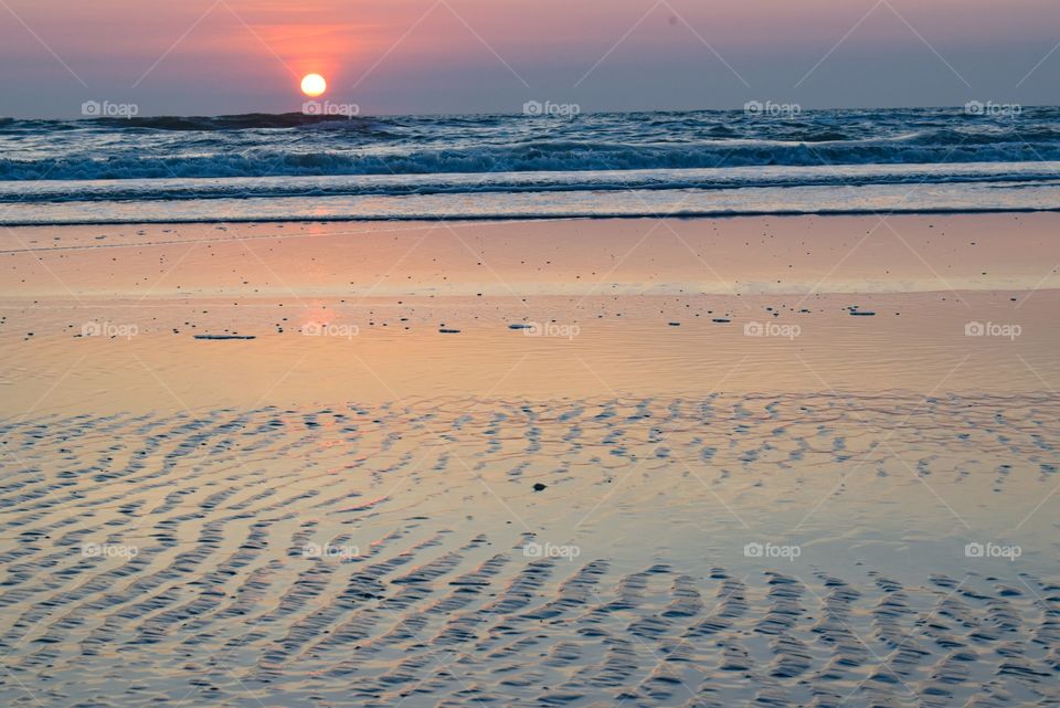 simmering sunlight on the beach during sunset