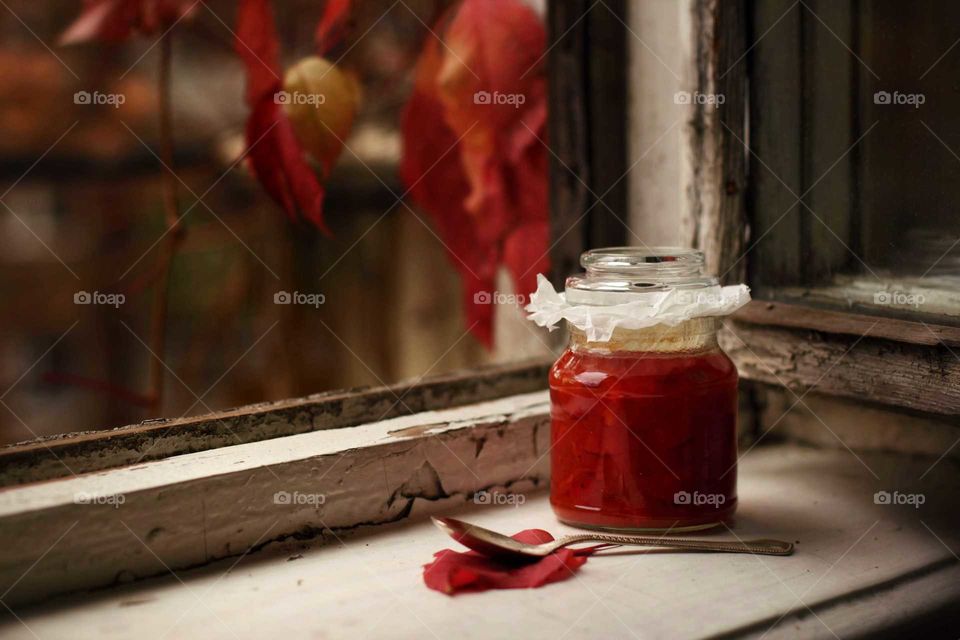 mom's rosehip jam on the windowsill in the fall