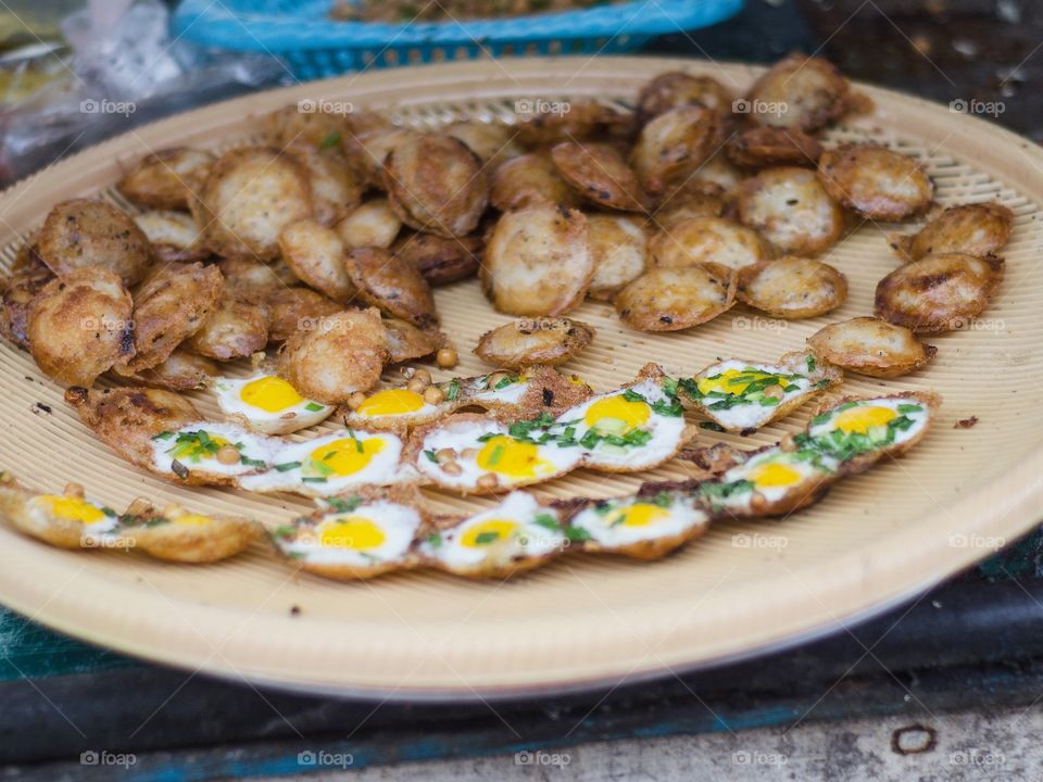 Street food at Yangon, Myanmar. Quail Egg Omelettes.