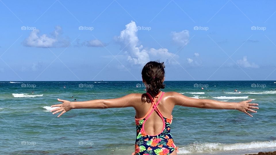Child looking at Miami Blue Sea