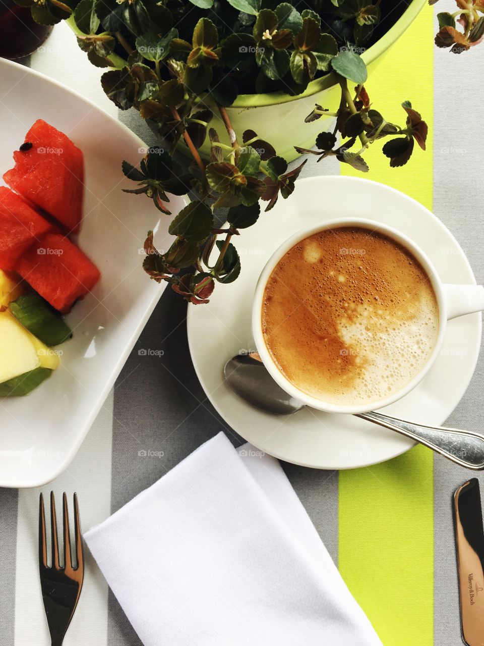 Enjoying a cappuccino with fruit. The perfect start to any day!
