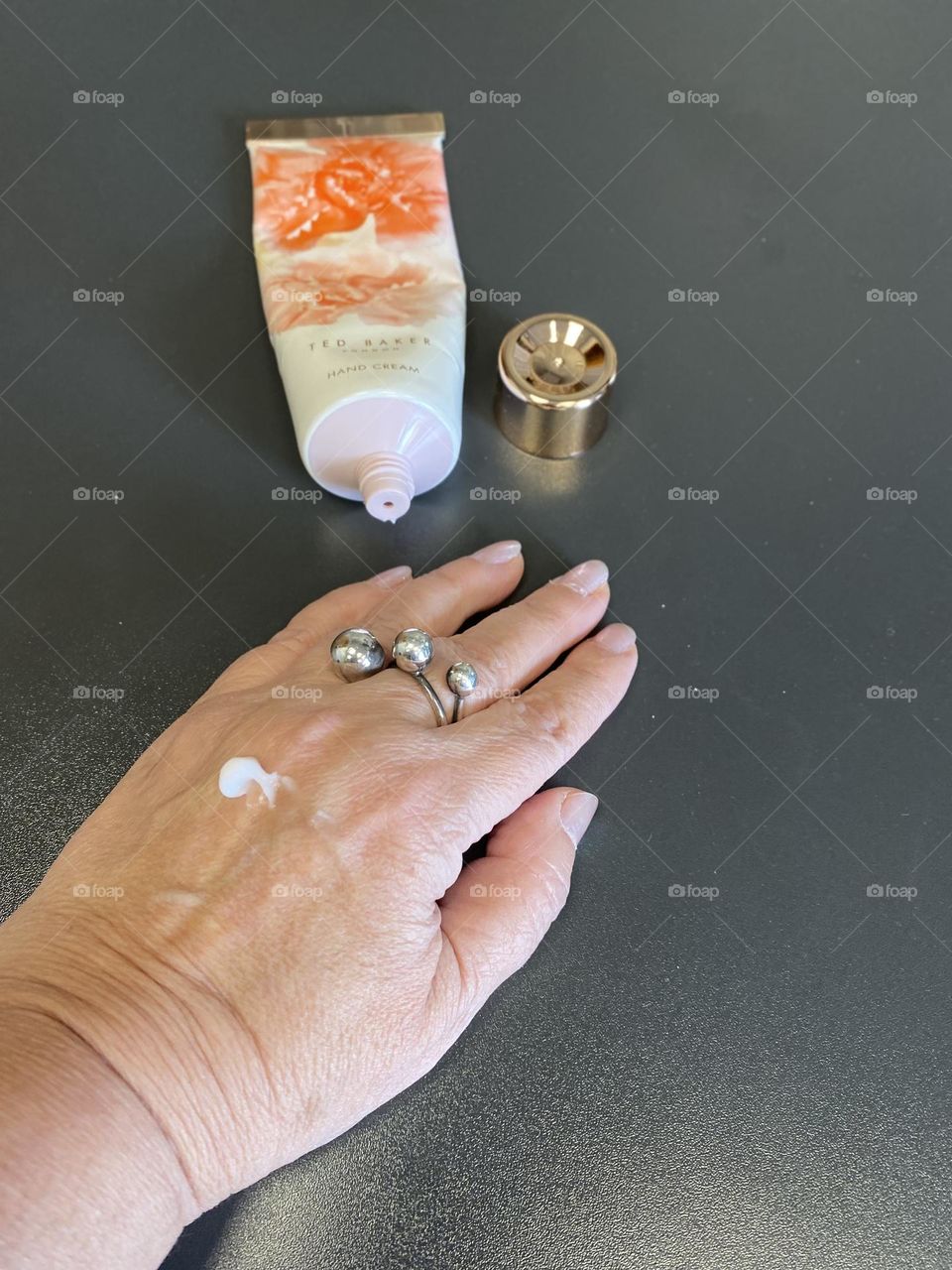 Hand cream on hand