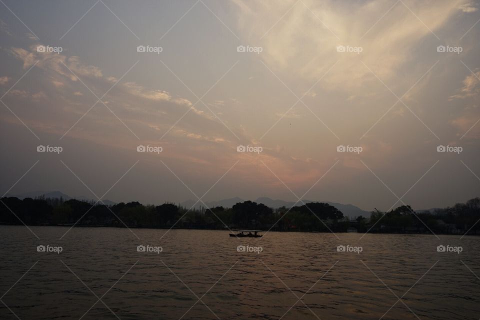 Sunset of west lake, one of the best jogging place, Hangzhou. A famous story was "born" here - The Legend of White Snake.
