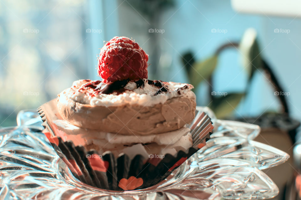 Beautiful gluten free cupcake with meringue crisps and gluten free buttercream chocolate and fresh fruit dessert 