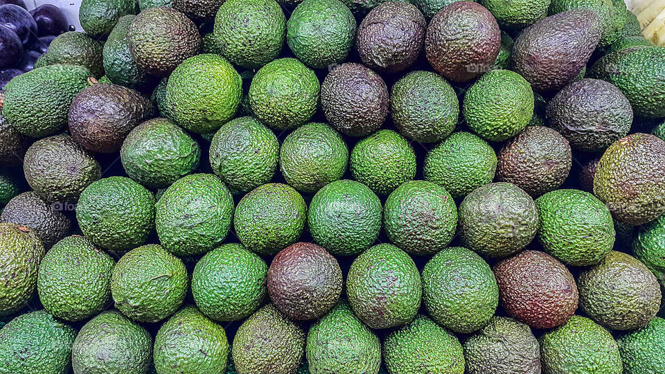 Close-up of avocados for sale in market