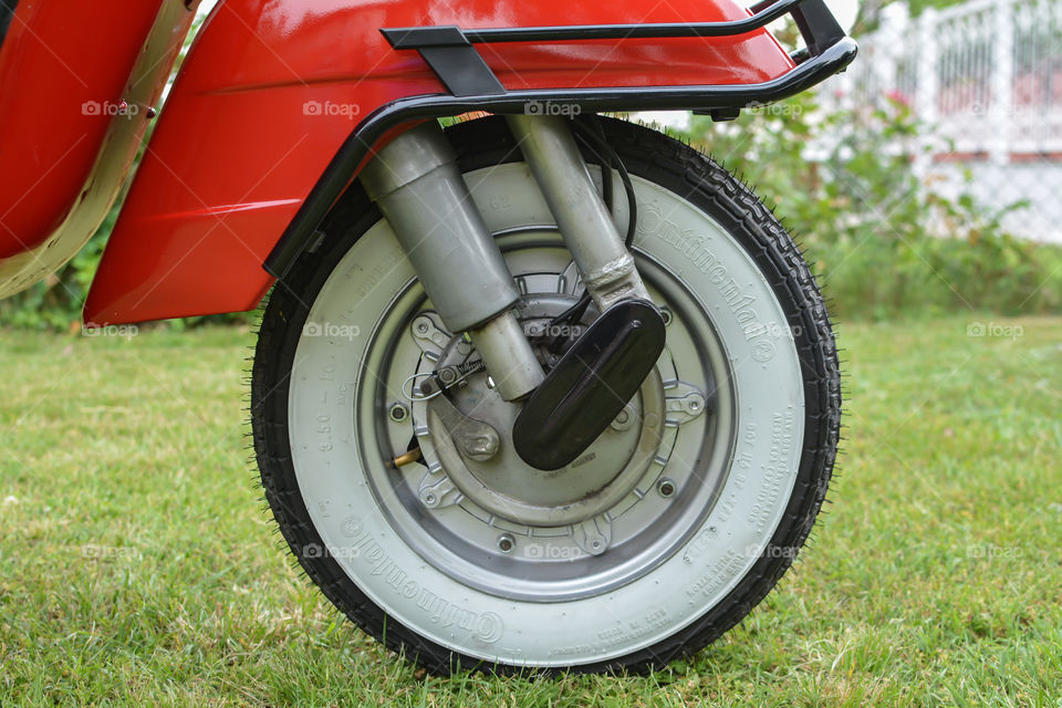 vintage motorcycle vespa with white wall tyres